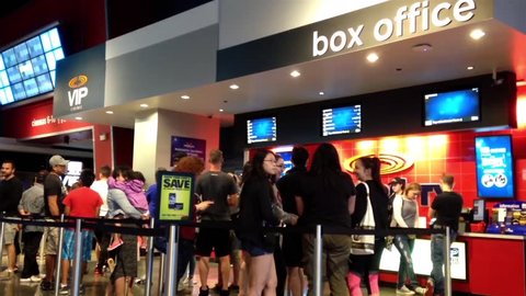 Coquitlam, BC, Canada - August 01, 2015 : People line up for buying movie ticket at cinema