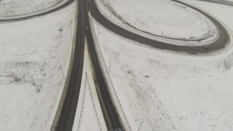 Aerial shot of camera follows the car in winter