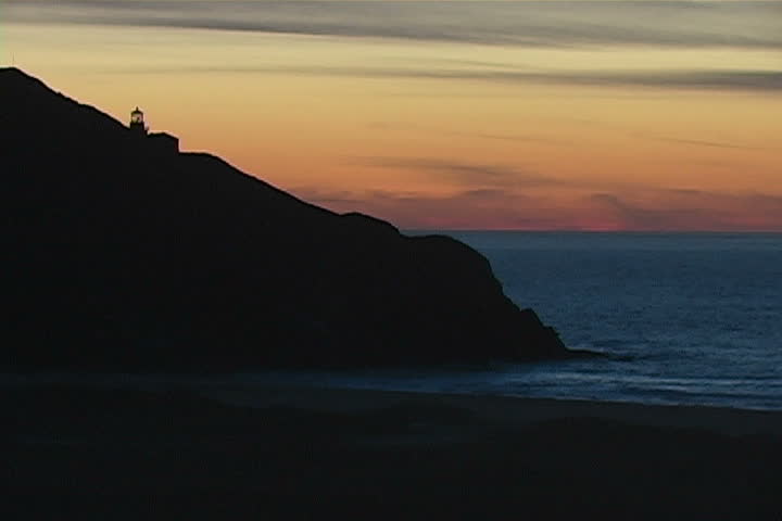 A beautiful lighthouse along the Big Sur coast at dusk.
