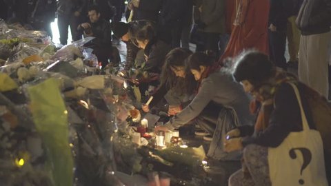 Paris terror attacks - Shrine at night, place de la République
Shrine, flowers, and people paying tribute at night on place de la République after Paris terror attacks on November 13, 2015