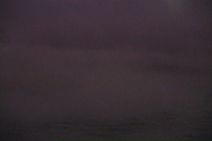 An eerie lake explodes into a bright display of water. 
