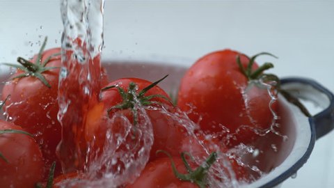 Water splashing onto tomatoes in slow motion, shot at 1000 frames per second on Phantom Flex 4K