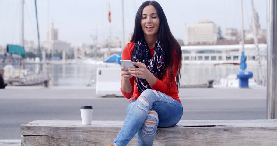 Relaxed confident young woman on a mobile