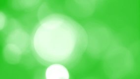 Beautiful blurred green abstract video background. Blurry out of focus lights. Christmas (Xmas) or New Year holiday bright colorful bokeh backdrop 