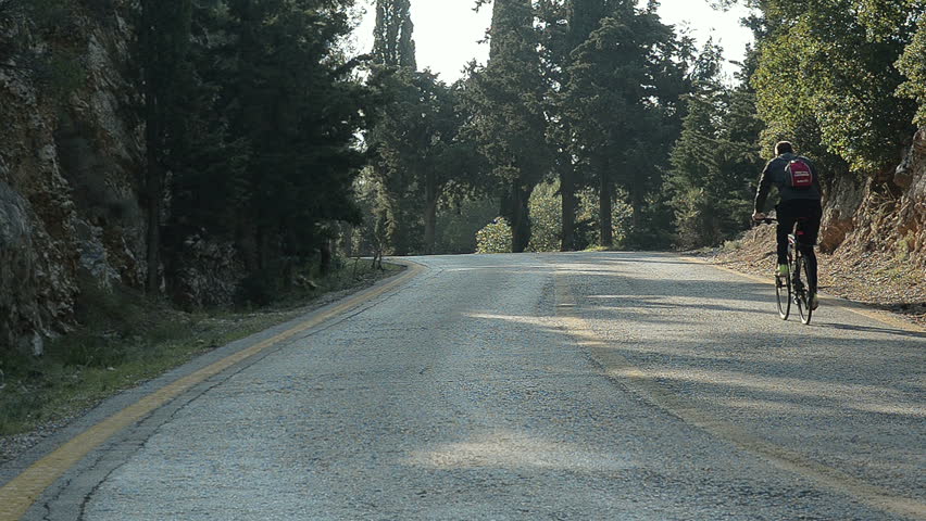 Cyclist Going Up In the Mountains