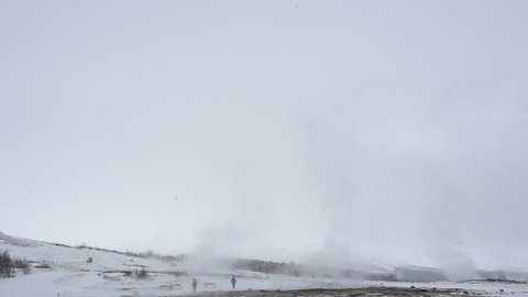 Slowmotion of Geyser Strokkur eruption in Iceland in winter on a cloudy day