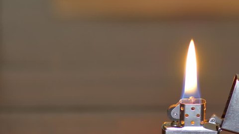 HALLANDALE - FEBRUARY 6: Macro video of a Zippo windproof lighter displaying a flame. Zippo was founded in America in 1932 by George Grant Blaisdell February 6, 2016 in Hallandale FL