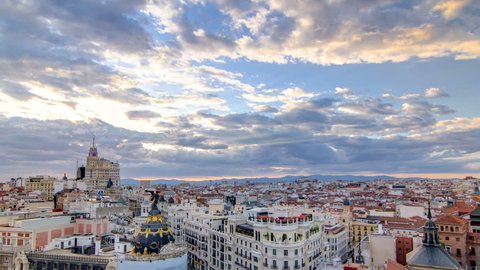 Panoramic aerial view of Gran Via timelapse at sunset, Skyline Old Town Cityscape, Metropolis Building, capital of Spain, Europe.