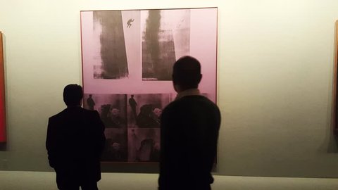 TEHRAN, IRAN, DEC 2015: People looking at a painting by Andy Warhol in Tehran museum of contemporary art considered to have the most valuable collection of Western modern art outside Europe & US