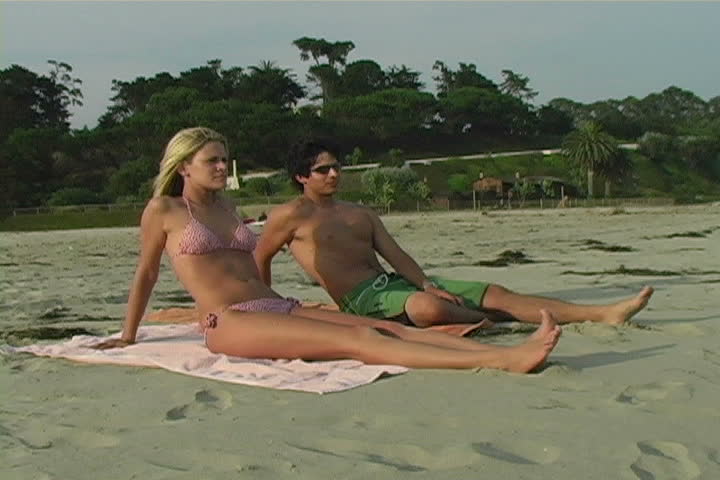 Young couple relaxing on the beach.