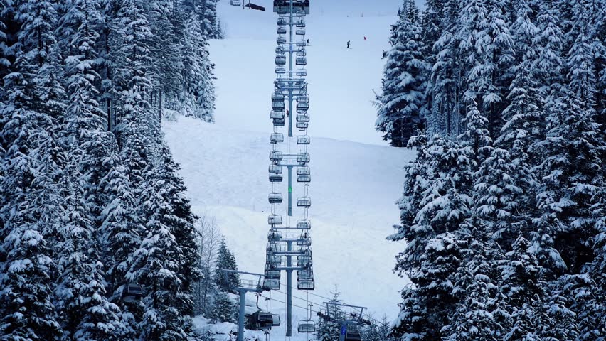 Ski lift Going Up Snowy Mountainside
