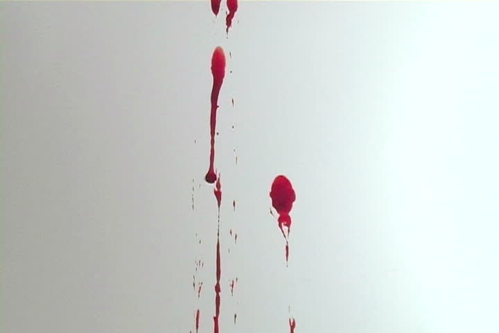 Blood splattering on a white wall.