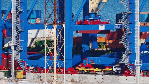 ODESSA - JANUARY 29: (TIMELAPSE) Long shot of unloading container ship gantry crane in port on January 29, 2016 in Odessa, Ukraine.
