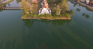 A 4k, 25 fps aerial footage of Wat Traphang Thong, an ancient temple in Sukhothai world cultural heritage area. The place is public property, no release document required.
