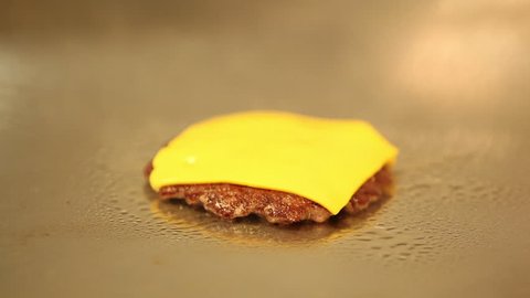 Patty burger with cheese for frying in a pan