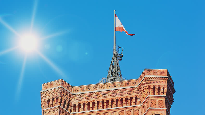 Berlin Flag Blowing on the Red City Hall, Artificial Sun is Rising

