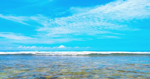 Clear summer sea landscape background. Ocean waves and blue sky at sunny day