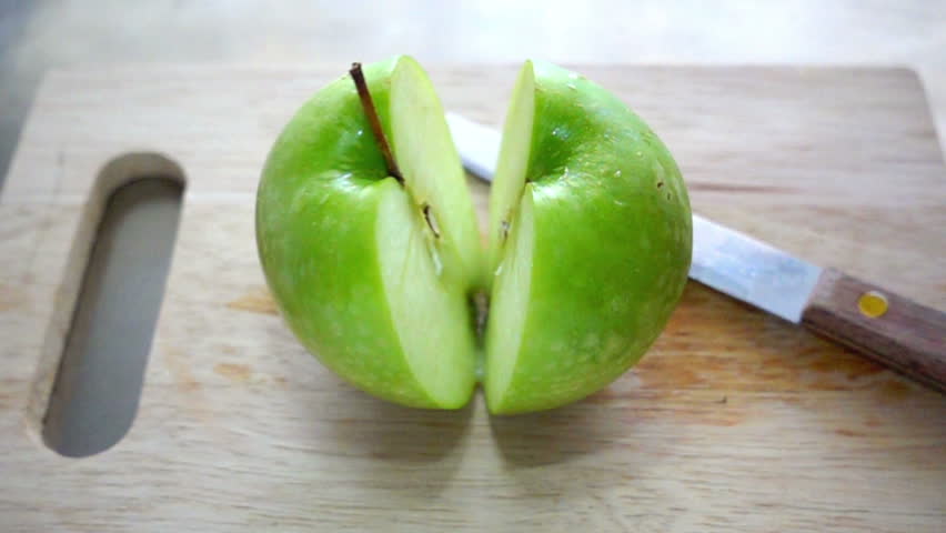 Cutting A Green Apple In Stock Footage Video 100 Royalty Free Shutterstock