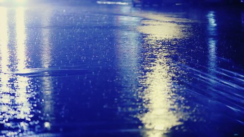 it's raining. raindrops, street, colorful traffic lights at night, blur bokeh abstract background vintage color tone, Cool chill wet raining season, concept.