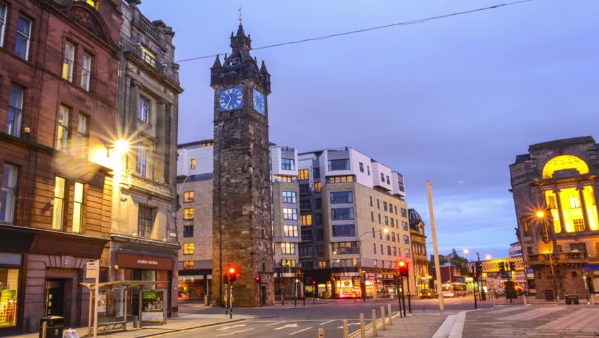 TOLLBOOTH AND CITY CENTRE, GLASGOW OCTOBER 2014. Glasgow city at night time lapse with clock tower tollbooth and traffic.