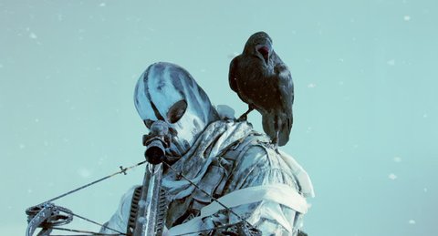 The soldier with the crossbow and Raven. Fantasy. The post Apocalypse.