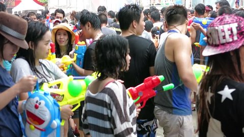 Bangkok, Thailand-April 15, 2014: People playing water each other in the Songkran Festival. One of activities is playing water.  People use water guns to play and celebrate the Thai New Year.