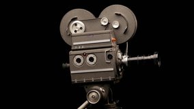 Vintage Hollywood Movie Camera in Front of Black Backdrop. Suitable for Tv Show, Film Title, or Credits.