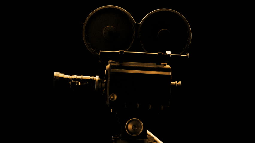Vintage Hollywood Movie Camera in Front of Black Backdrop. Suitable for Tv Show, Film Title, or Credits.