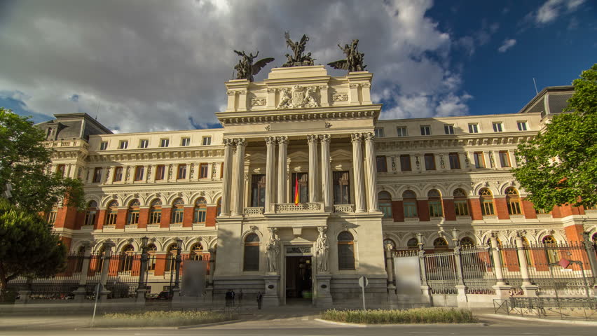 beautiful government palace facade the Ministry of Agriculture building timelapse hyperlapse is placed close to the Atocha railway station in Madrid, Spain.
