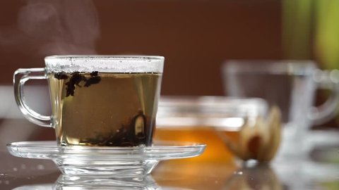Transparent cup of tea on the table