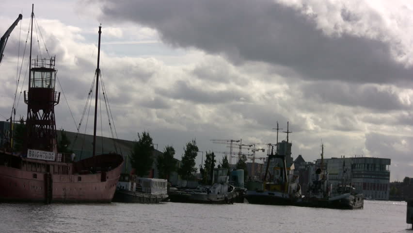 Light-boat moored under a threatening cloud