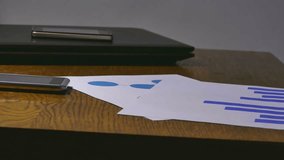 businessman  holding a chart analyst sales documents - Powered by Shutterstock - Get 15% off with code: PIKWIZARD15