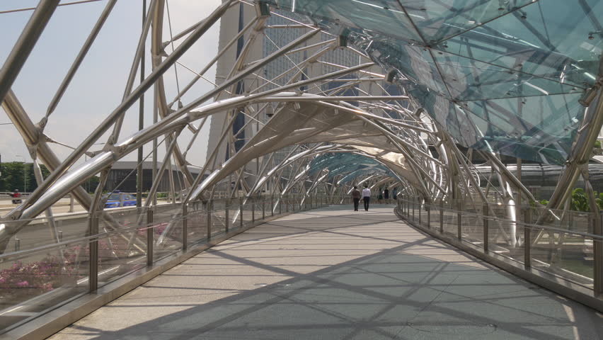 sun light helix bridge walking tourist marina bay sands view singapore