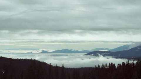 Fog drifts over Diamond Lake in the Oregon Cascade Mountains Time Lapse