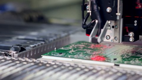 Surface Mount Technology Machine places elements on circuit boards