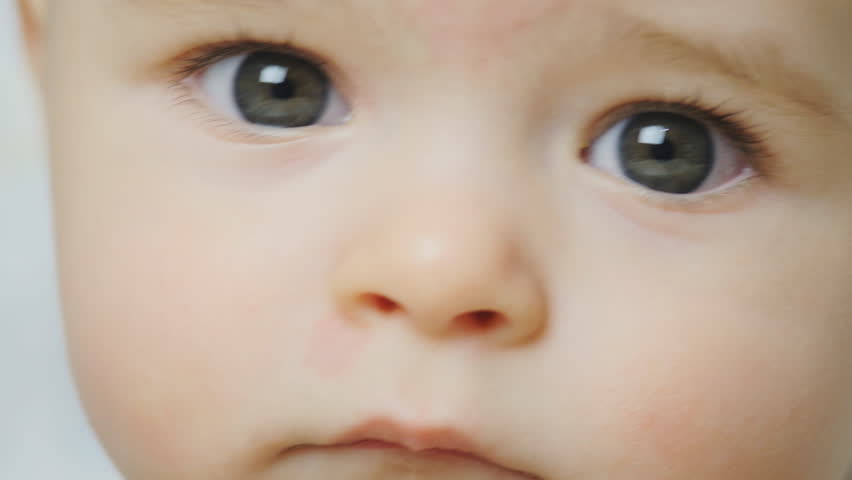 baby's face looks around extremely close Stock Footage Video (100% ...