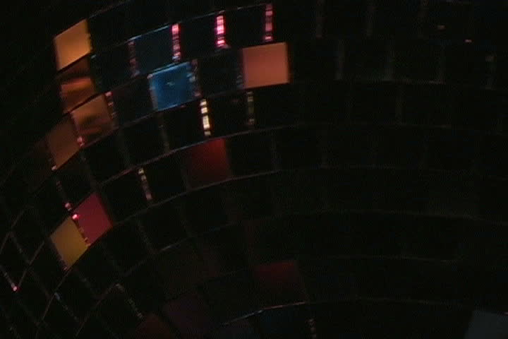 A close-up view of a disco ball spinning.