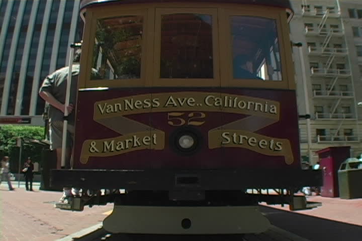 A world famous San Francisco cable car departing.