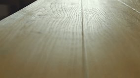 New oak parquet of brown color - dolly motion. RAW video record.