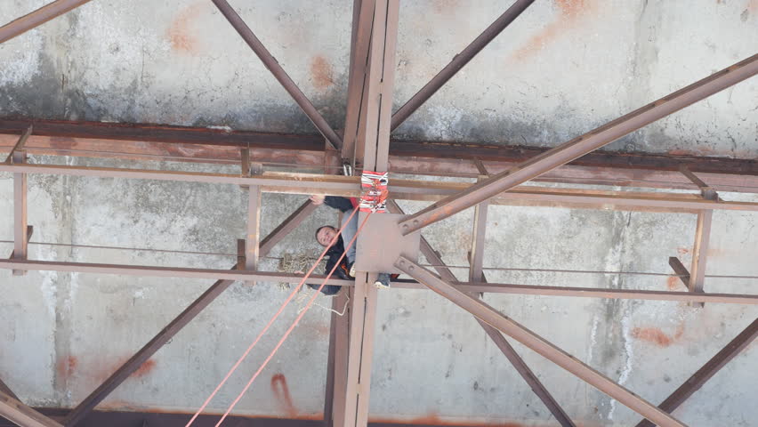 climbers working on the bridge - mounted system for jumping

