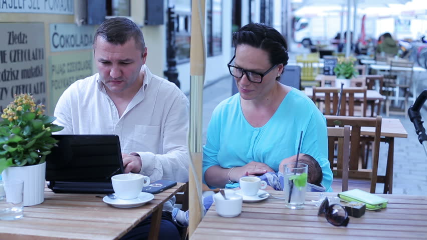 Father working on laptop 
