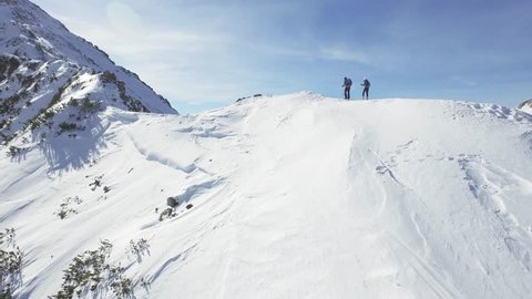 Man Woman Climbers Walking Up Winter Snow Mountain Slope Climbing Toward Peak Success Pursuit Challenge Exploration Everest Expedition Concept
