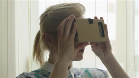 Young Woman in Virtual Reality Glasses. VR. Google cardboard. VR. Google cardboard Stock Video