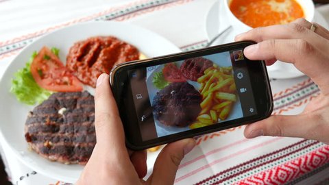 Take a photo picture of food with mobile phone camera and viewing sliding gallery