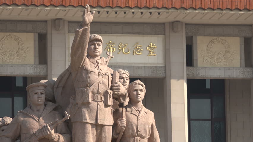 BEIJING, CHINA - 14 SEPTEMBER 2015: Communist inspired statue in front of the Mao Zedong mausoleum on Tiananmen Square in Beijing