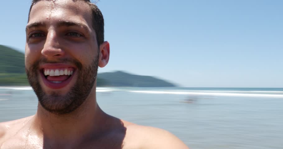 Young man taking selfie on brazilian beach Royalty-Free Stock Footage #14636338