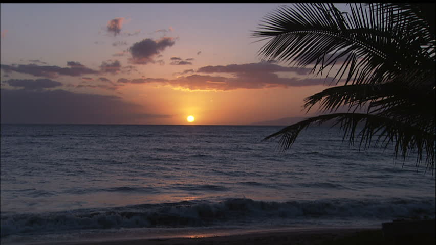 Tranquil Hawaiian Beach With Gentle Surf At Sunset