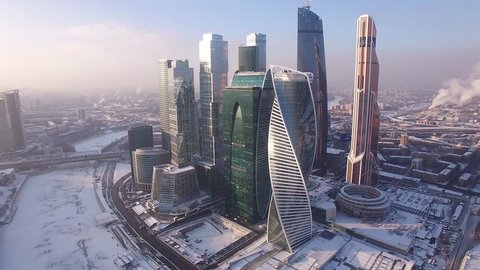 WINTER Moscow city business center. Russian skyscrapers. Cowered in snow and ice. Aerial FPV Drone Flights. UltraHD 4K