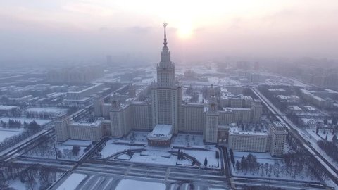 Beautiful frozen WINTER Moscow city cowered in snow and ice. Stalin skyscraper. Aerial FPV Drone Flights. UltraHD 4K