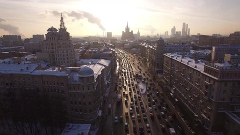 Beautiful frozen WINTER Moscow city cowered in snow and ice. From above. Road traffic jam. Aerial FPV Drone Flights. UltraHD 4K